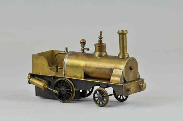 Appraisal: SCHOENNER DRIBBLER LOCOMOTIVE Early example brass boiler and frame piston