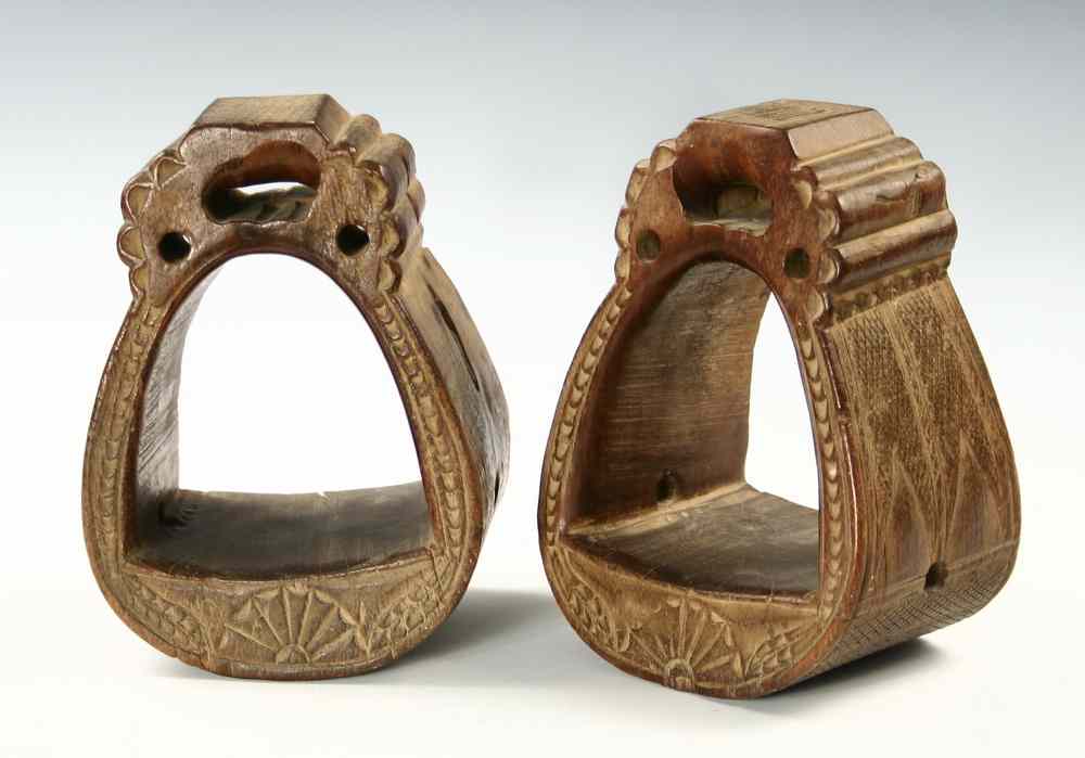 Appraisal: STIRRUPS - th c carved hardwood stirrups with checkered carving