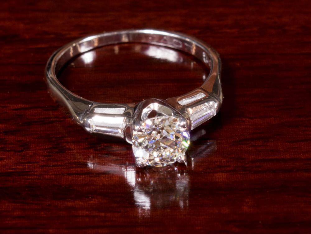 Appraisal: ESTATE DIAMOND AND WHITE GOLD THREE-STONE RING with a pair