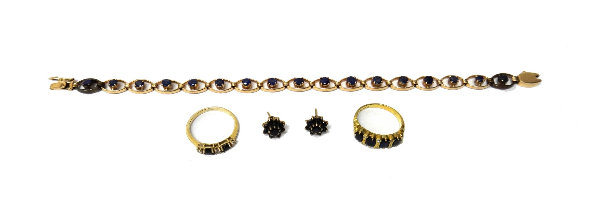 Appraisal: A gold and sapphire bracelet in an oval openwork link