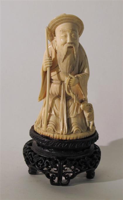 Appraisal: Chinese carved elephant ivory shepherdSeated figure grasping goat and staff