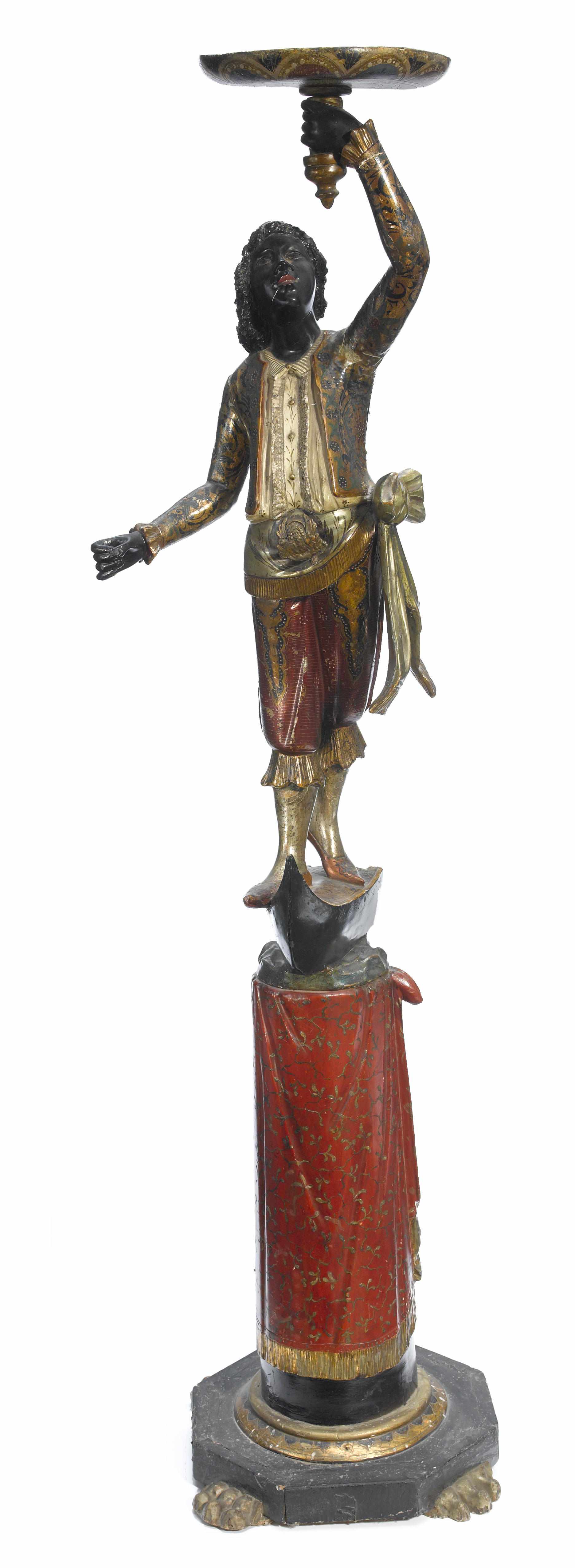 Appraisal: A Venetian polychrome decorated figural torchre late th centuryheight in