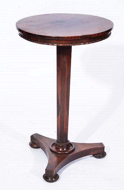 Appraisal: AN EARLY VICTORIAN CARVED ROSEWOOD LAMP TABLE with circular top