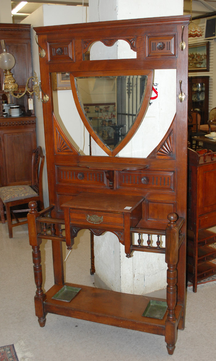 Appraisal: VICTORIAN WALNUT HALLSTAND English late th century centering a shield-shaped