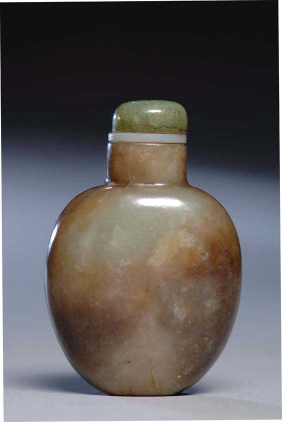 Appraisal: ANTIQUE JADE SNUFF BOTTLE Well hollowed and antique mottled green