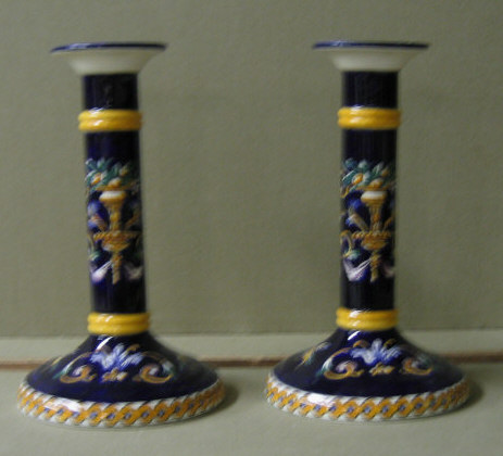 Appraisal: PAIR OF FRENCH MAJOLICA CANDLESTICKS Dark blue with polychrome enamel