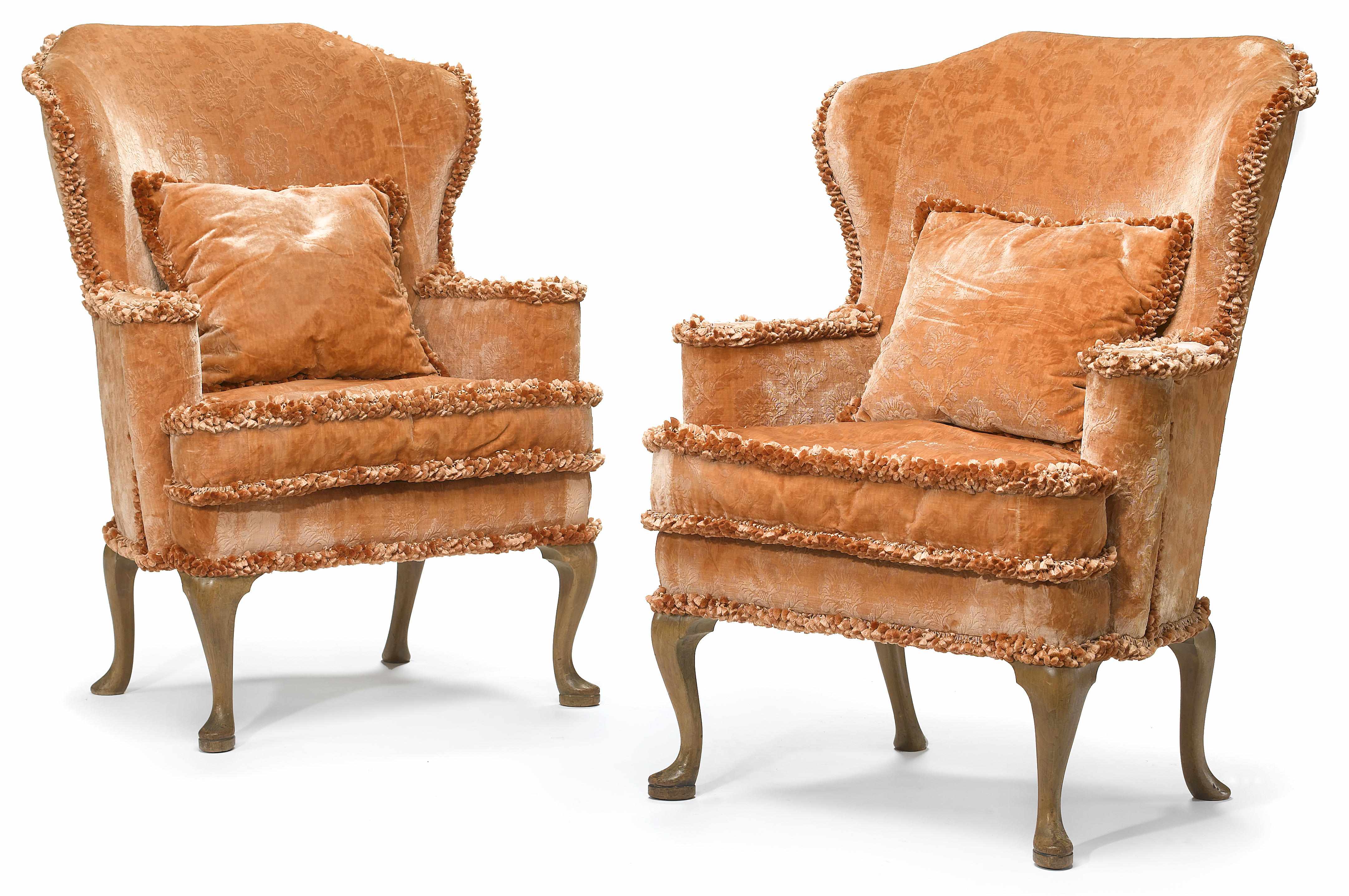 Appraisal: A pair of George I style walnut framed wing armchairs