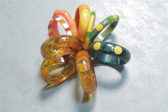 Appraisal: NINE BRACELETS Three Bakelite reverse carved one with painted fish