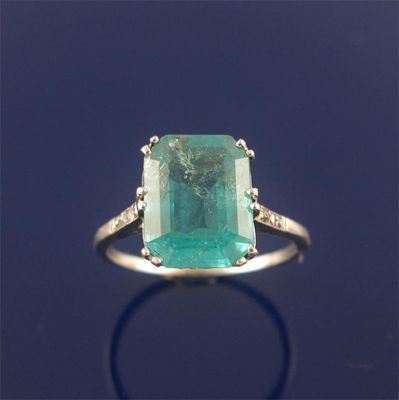 Appraisal: An emerald and diamond ring the emerald cut emerald is