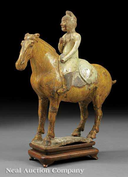 Appraisal: An Antique Chinese Partial Glazed Pottery Figure of an Equestrian