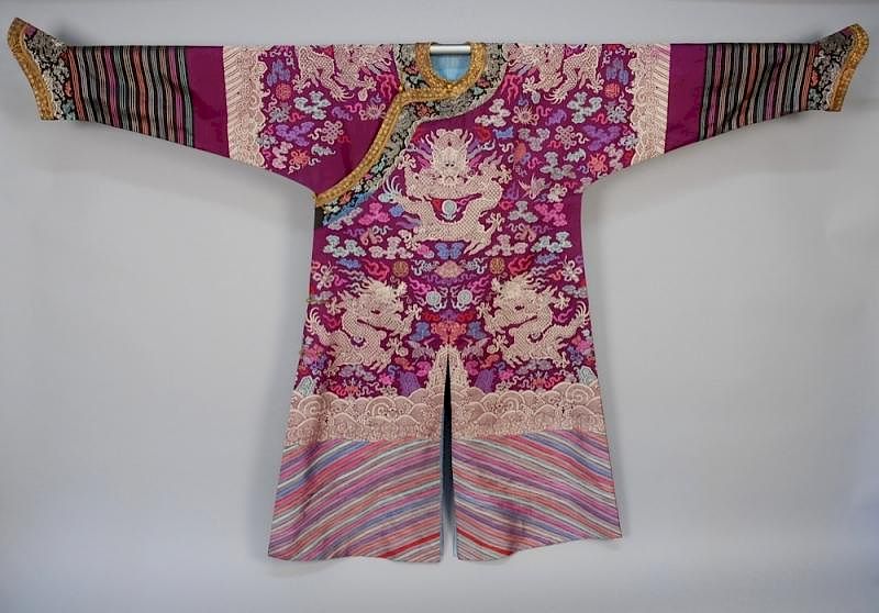 Appraisal: CHINESE SILK BROCADE ROBE th C Purple silk decorated with