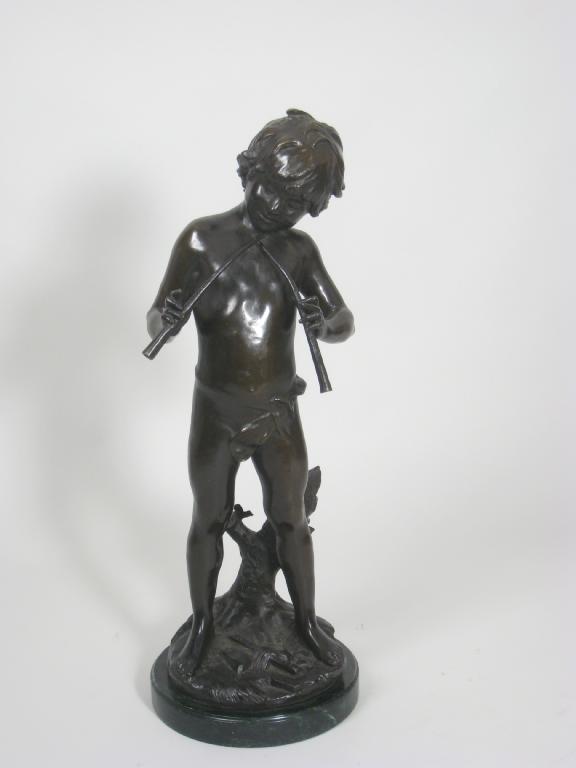 Appraisal: A bronze Figure of a standing piper on circular green