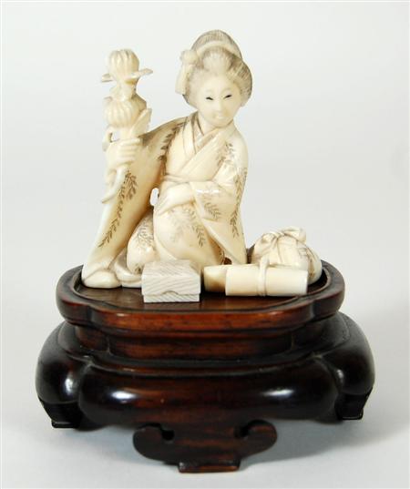 Appraisal: A Japanese ivory okimone Meiji or Taisho period depicting a