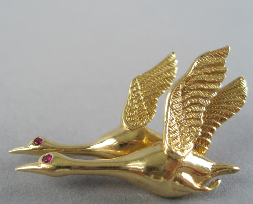 Appraisal: A Gold and Ruby Flying Geese Brooch K marked yellow