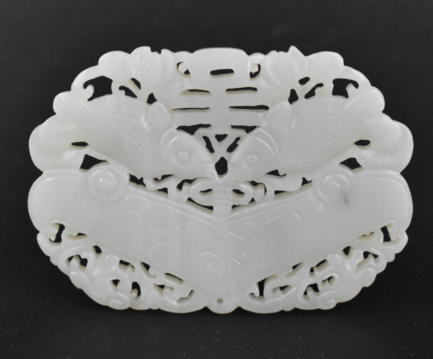 Appraisal: A Chinese white jade carved pendant with twin fish dating