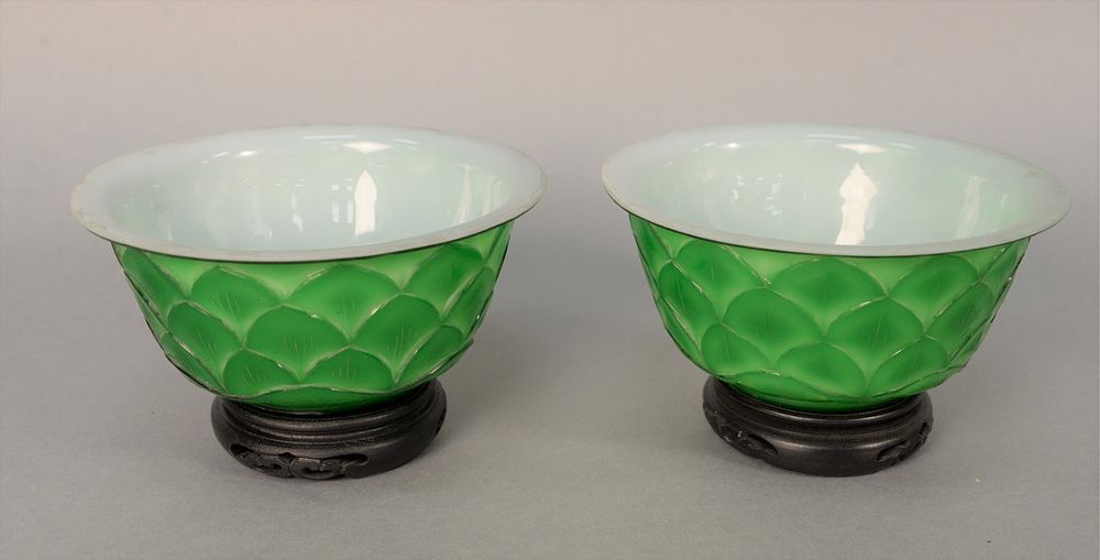 Appraisal: Pair of Chinese Peking Overlay Glass Bowls having green exterior