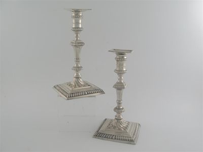 Appraisal: A pair of George III 'out of period' cast candlesticks