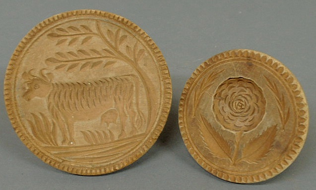 Appraisal: Two th c carved wood butter prints- cow dia and