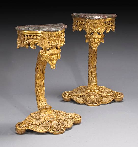 Appraisal: A pair of Continental Baroque carved giltwood console tables first