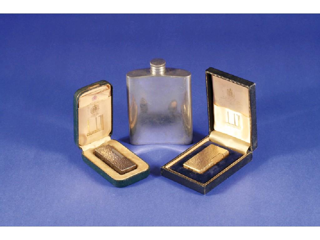 Appraisal: TWO DUNHILL ROLLAGAS 'S CIGARETTE LIGHTERS cased and a pewter