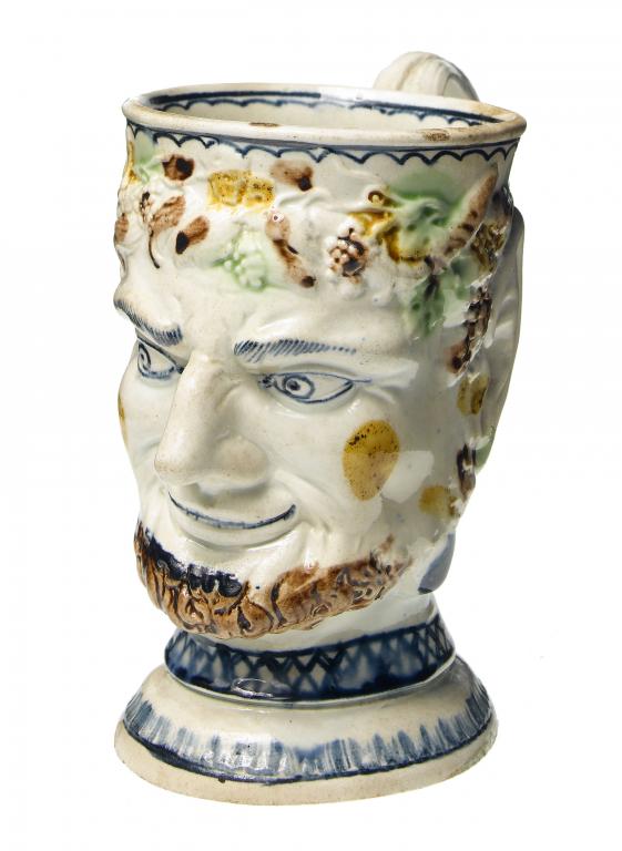 Appraisal: A CREAMWARE SATYR MUG with rustic entwined handle painted in