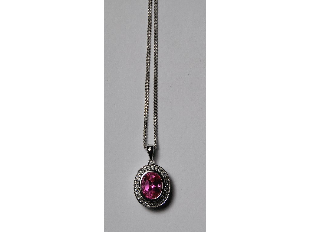 Appraisal: Oval pink sapphire and diamond set pendant ct white gold