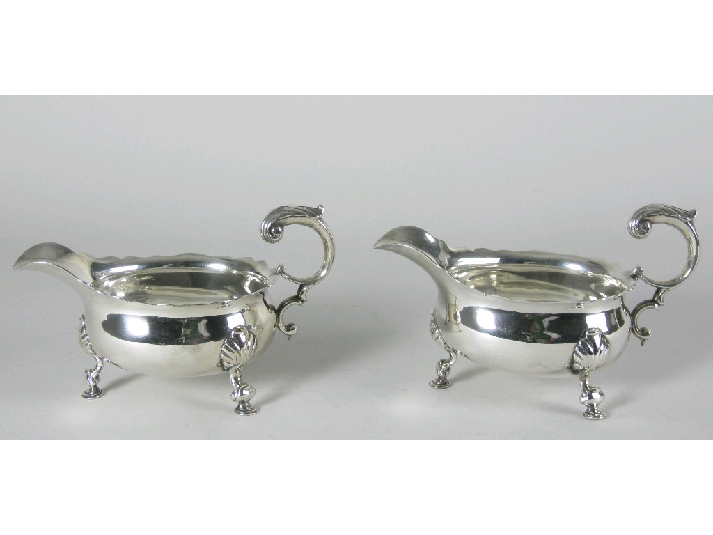 Appraisal: Pair of George II Sauce Boats with shaped rims leafage