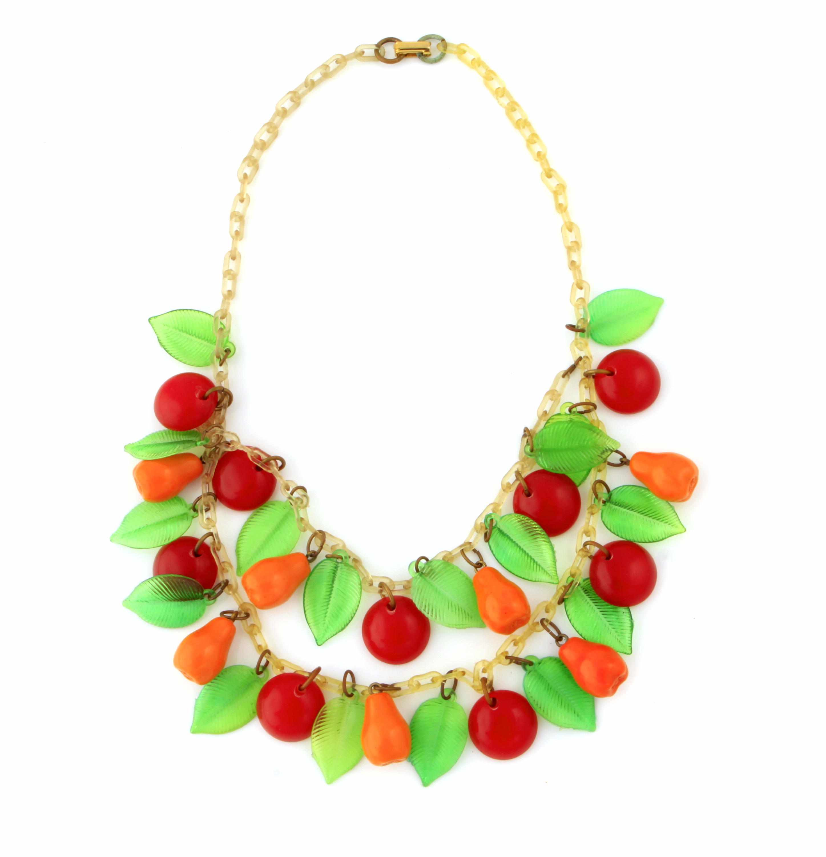 Appraisal: A Bakelite and celluloid fruit necklace length in