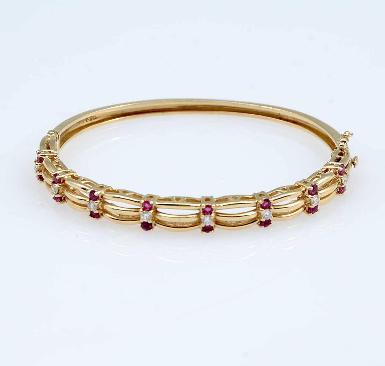 Appraisal: K RUBY DIAMOND BANGLE BRACELET K yellow gold bangle bracelet