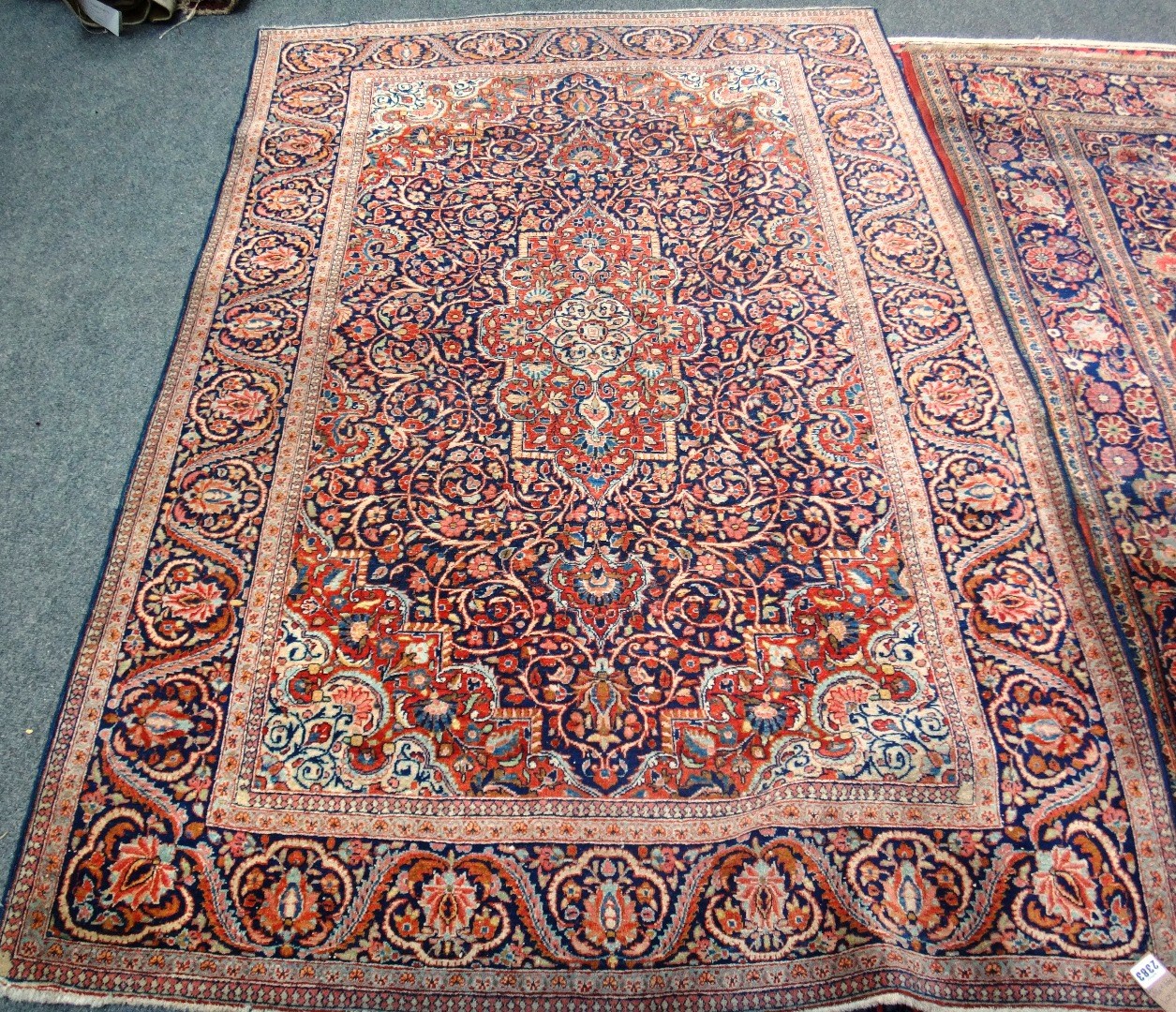 Appraisal: A Kashan rug Persian the dark indigo field with a