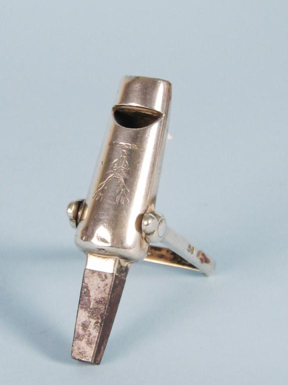 Appraisal: A Victorian Whistle and Cartridge Puller with steel square section