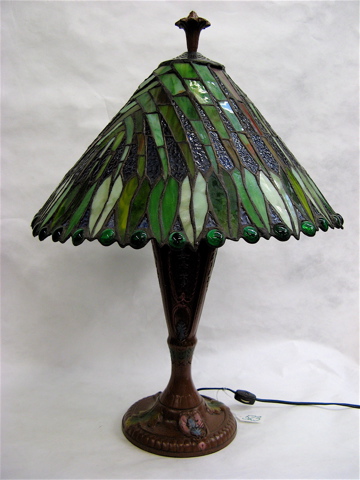 Appraisal: STAINED GLASS TABLE LAMP the glass shade in various greens