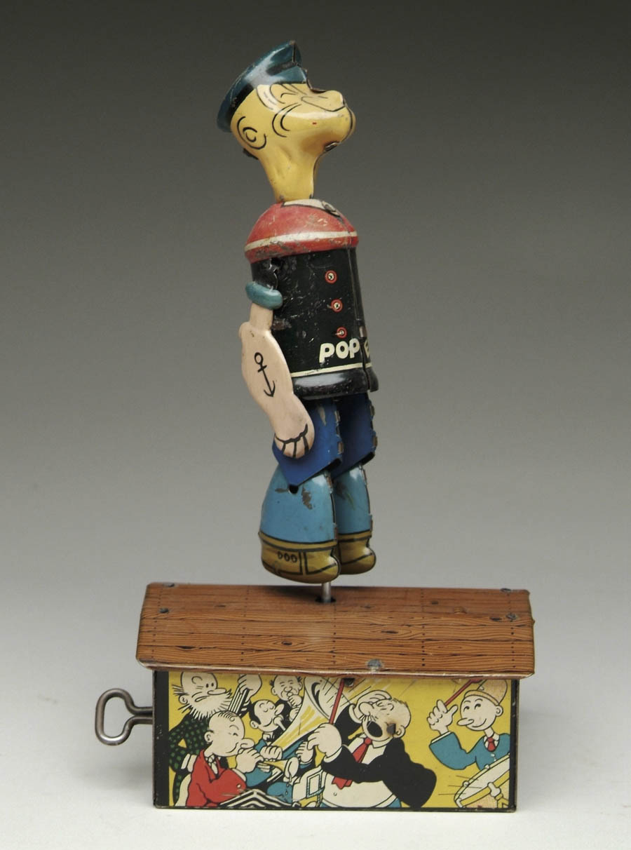 Appraisal: MARX POPEYE JIGGER Popeye dances on a colorful lithographed box