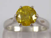 Appraisal: An carat white gold round brilliant cut yellow diamond solitaire