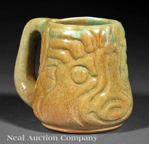 Appraisal: A Shearwater Art Pottery Fish Mug c design by Walter