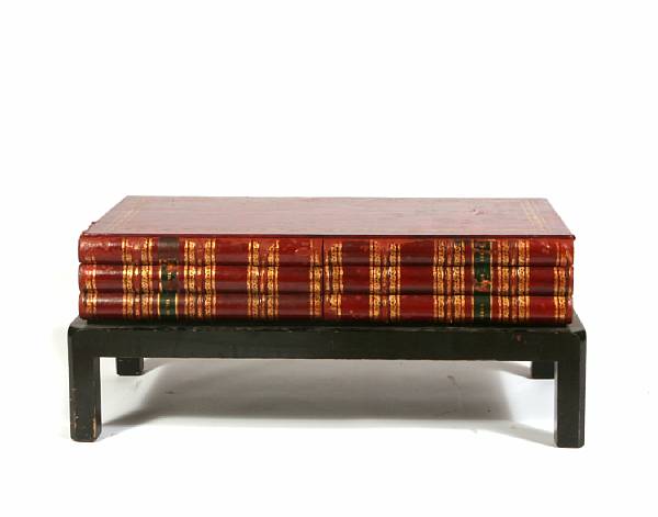 Appraisal: A pair of coffee tables with faux book tops height