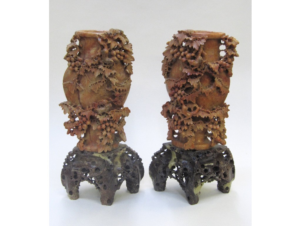 Appraisal: Pair of soapstone vases carved with rats on fruiting vines