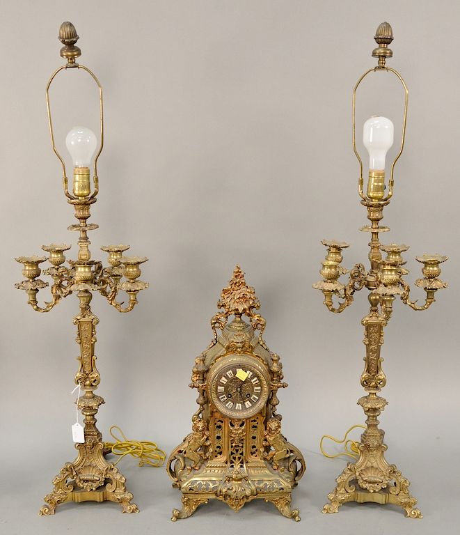 Appraisal: Three piece brass clock set with candelabra lamps ht in