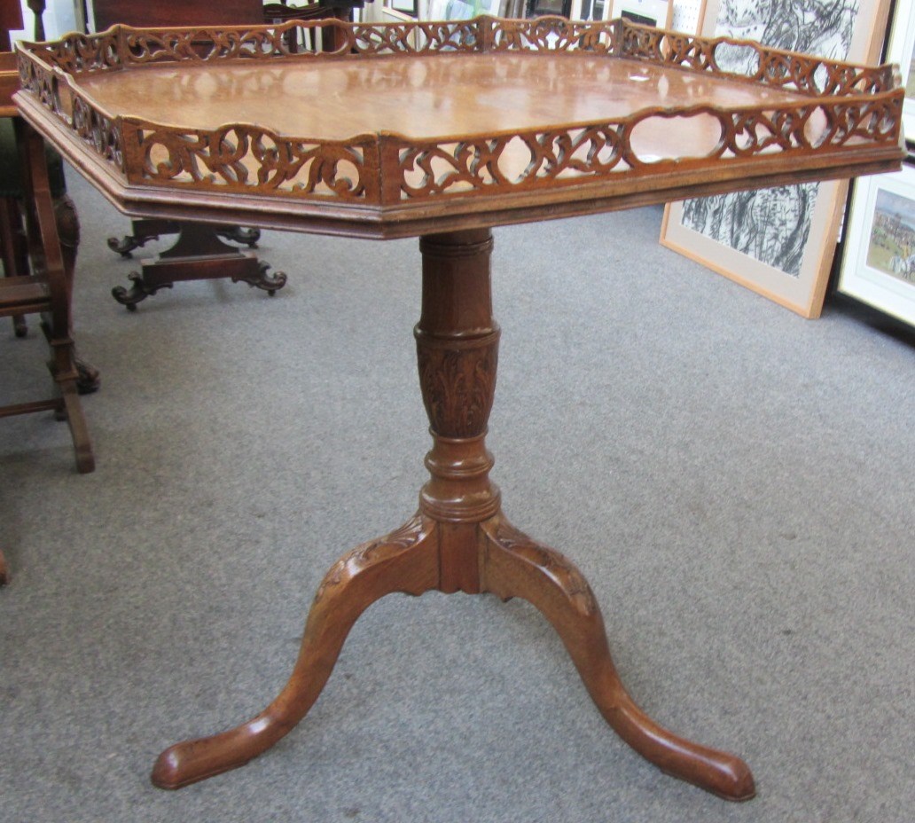 Appraisal: A George III mahogany occasional table the canted square snap