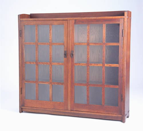 Appraisal: GUSTAV STICKLEY Two-door bookcase no with twelve panes per door