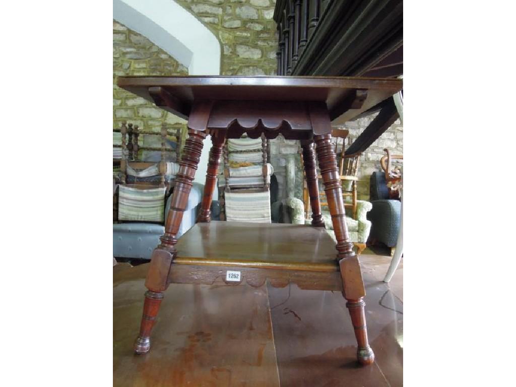 Appraisal: A late Victorian Edwardian walnut two tier occasional table of