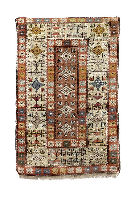 Appraisal: A wool ground Turkish rugwith multiple borders of flower and