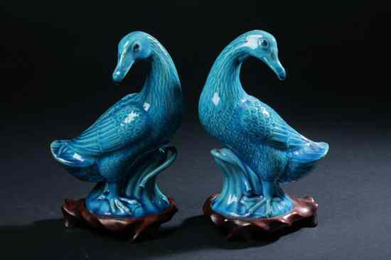 Appraisal: PAIR CHINESE TURQUOISE PORCELAIN FIGURES OF MANDARIN DUCKS ''China'' iron