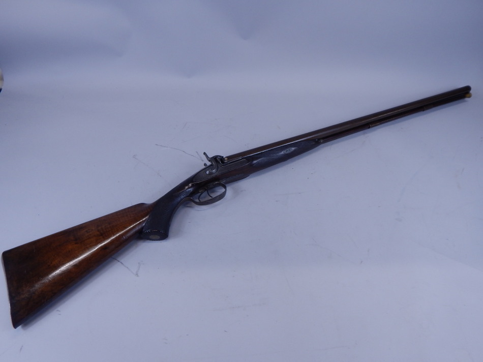 Appraisal: A muzzle loading double barrelled shot gun by George Gibbs