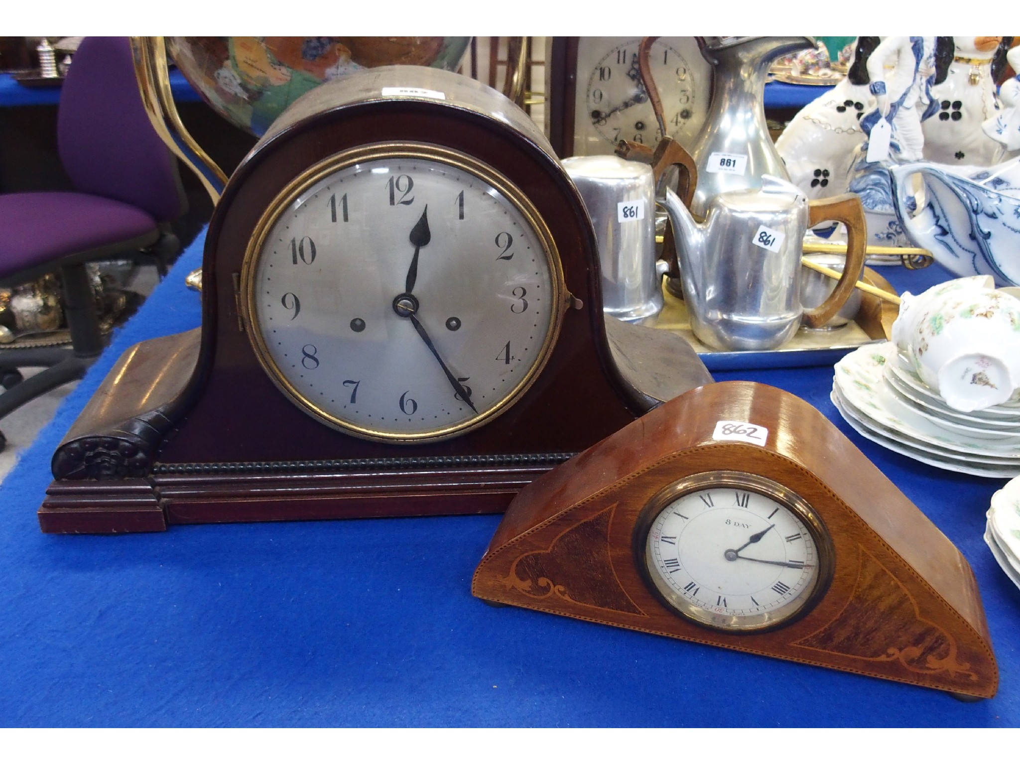 Appraisal: An Edwardian inlaid mantel clock and another larger