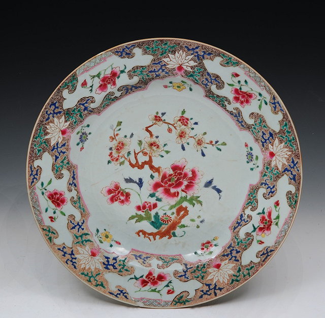 Appraisal: A CHINESE FAMILLE ROSE CHARGER with central flowering blossom within