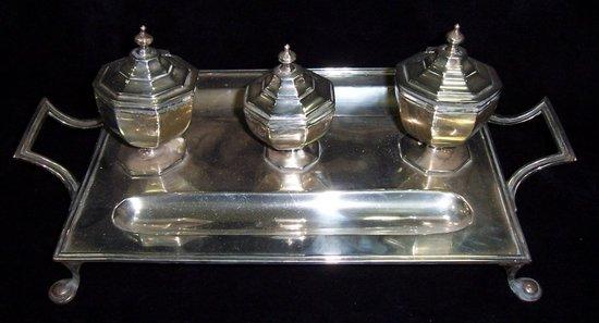 Appraisal: A silver table inkstand with three octagonal wells on a