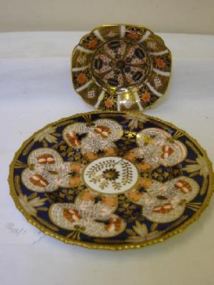 Appraisal: A ROYAL CROWN DERBY PORCELAIN PLATE with gadrooned border painted