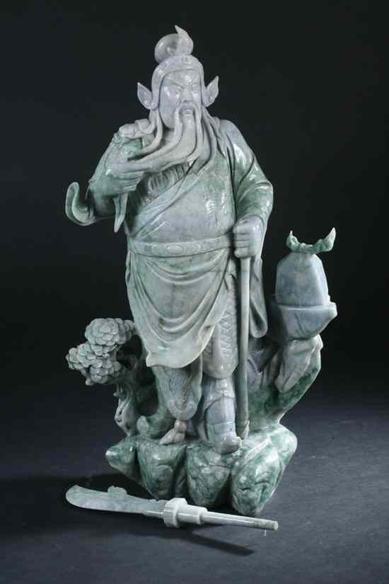 Appraisal: LARGE CHINESE APPLE GREEN AND CELADON JADE FIGURE OF GUANYU