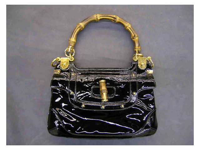 Appraisal: Gucci handbag black patent leather with bamboo handle black and